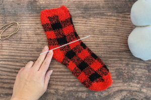 Red patterned sock cut across at the heel