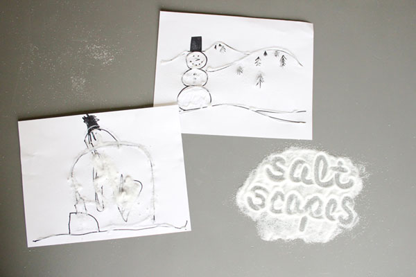 Papers decorated with salt to look like snowy landscapes