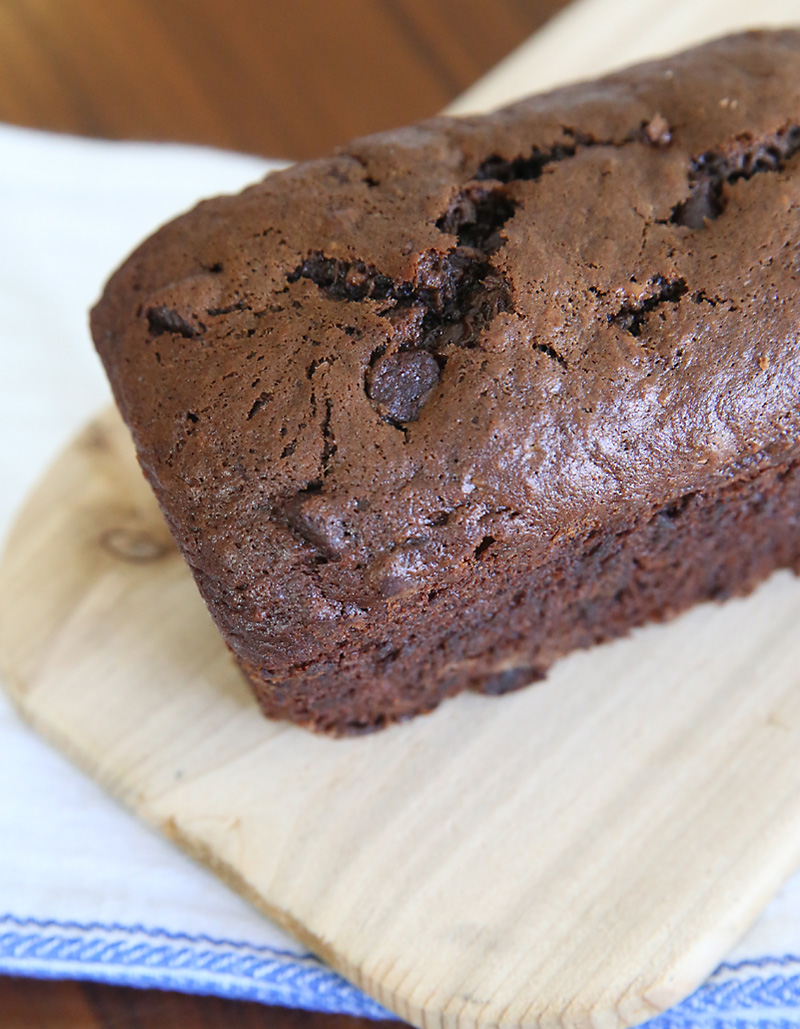 loaf of chocolate banana bread on a cutting board