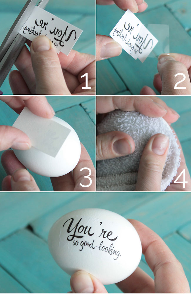 Placing a temporary tattoo on an Easter egg