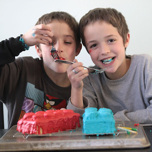 little boys eating birthday cake