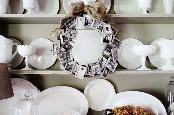 Wreath made from small silver photo frames tied with ribbon at the top