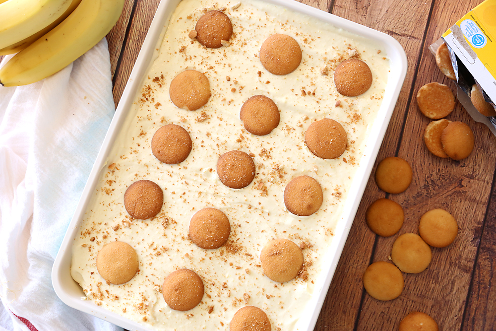 Banana pudding in a 9x13 pan with vanilla wafers on top