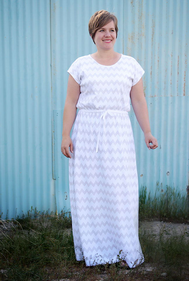 Woman wearing a long maxi dress with elastic at the waist