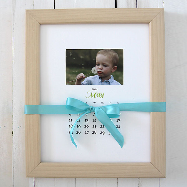 Photo calendar in a frame with a ribbon tied around it