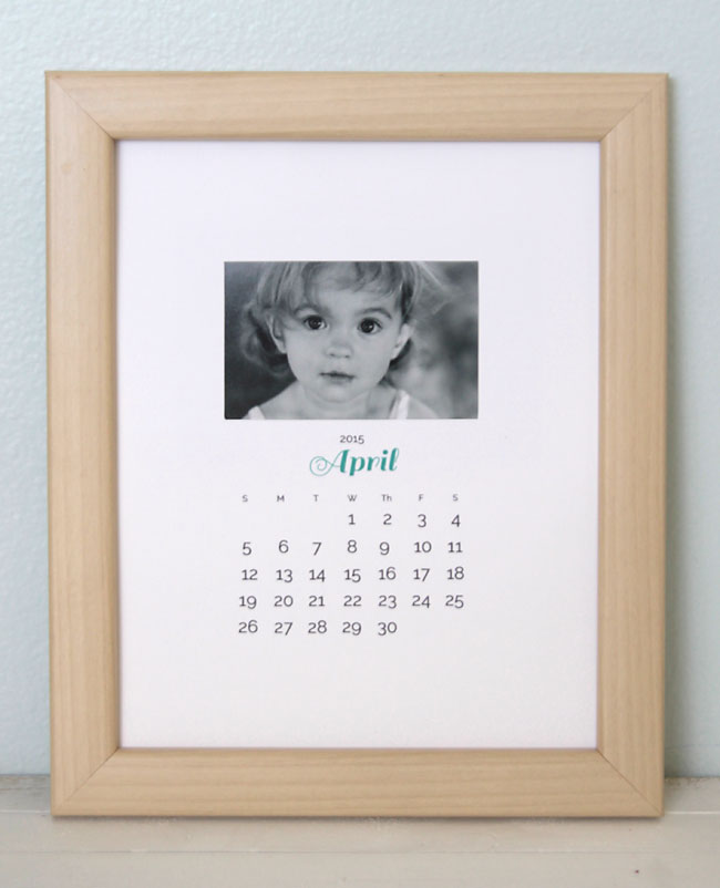 Calendar with photo of little girl on it, in a frame