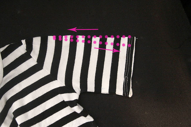 Sleeve hemmed, with lines of elastic thread marked