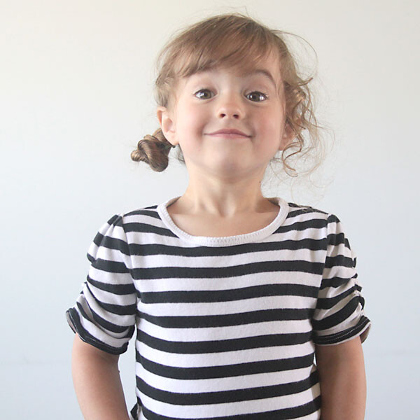 A young girl in a striped shirt