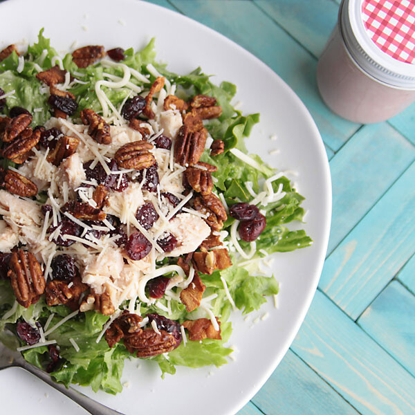 sweet sensation salad with chicken, nuts, cheese, and craisins on a plate