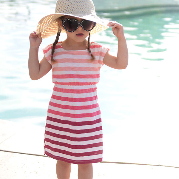 A woman in a sunhat and sunglasses wearing a DIY swimsuit coverup