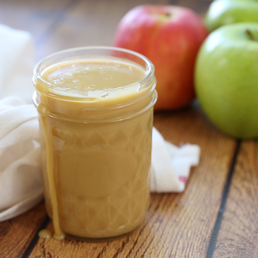 Sweetened condensed milk caramel in a jar with apples