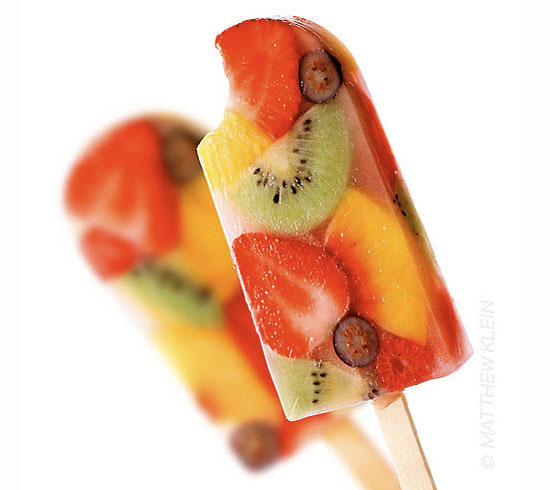 Homemade fruit popsicle with a bite taken out of it frozen dessert