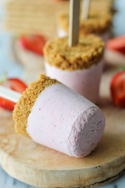 Cheesecake pop with graham cracker crust on a stick