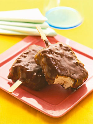 Frozen ice cream treat on a stick covered in chocolate