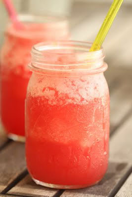 A red slushie drink in a jar