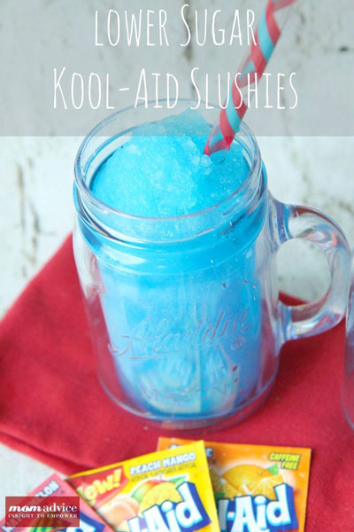 Blue Lower Sugar Kool-Aid Slushie in a glass mug with a straw