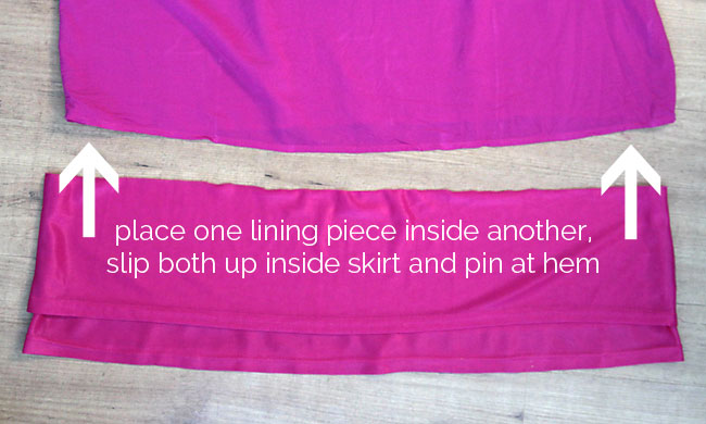 Lining pieces pinned inside dress hem