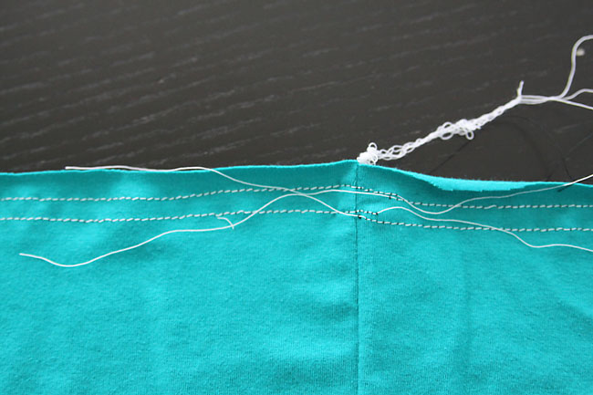 Gathering stitches along top edge of skirt