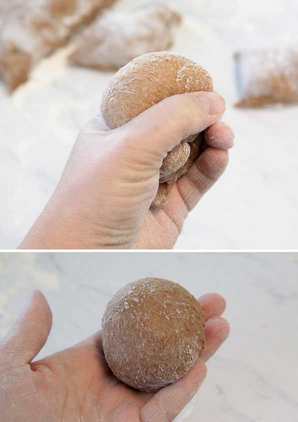 Hand shaping a roll, making a loop with finger and thumb and gently pushing dough through the loop