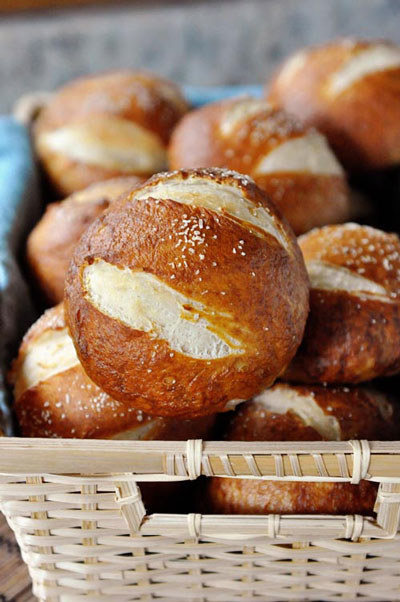 A basket full pretzel rolls