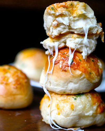 rolls full of cheese stacked atop each other