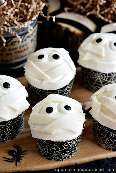 Nine-Eyed Creature Cupcakes Pumpkin pie spice gives these treats classic fall flavor while still staying true to the orange-and-black color scheme.