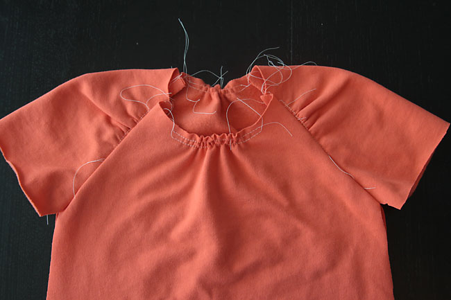 Sleeves sewn to dress front and back, with front and back necklines gathered