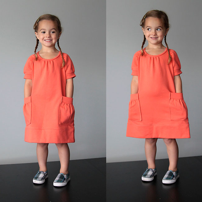 A little girl in a sweatshirt dress with pockets