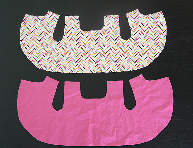 Teddy bear top pieces cut from pink fabric and lining cut from printed fabric