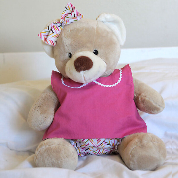 A teddy bear wearing clothes made from a free sewing pattern