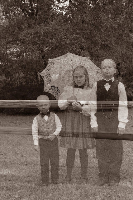 A vintage photo of a group of people where the people look semi transparent