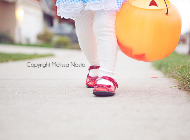 close up of baby girl\'s ruby slippers