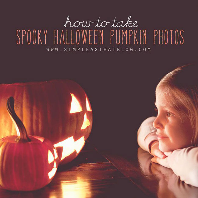 little girl looking at lit jack o lanterns