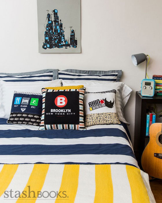 t-shirt pillows on a bed