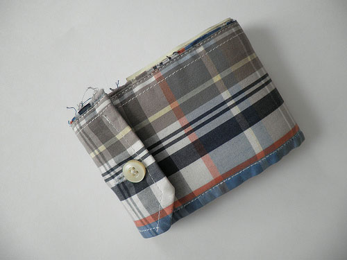 a wallet made from a shirt sleeve cuff