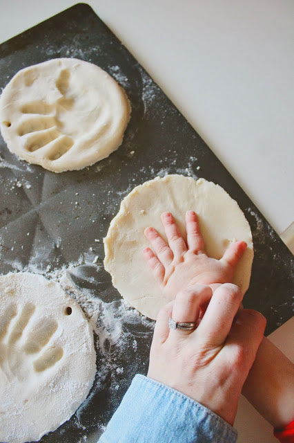 Baby making handprint in salt dough