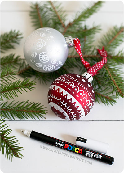 Christmas ornaments decorated with pen drawings and designs
