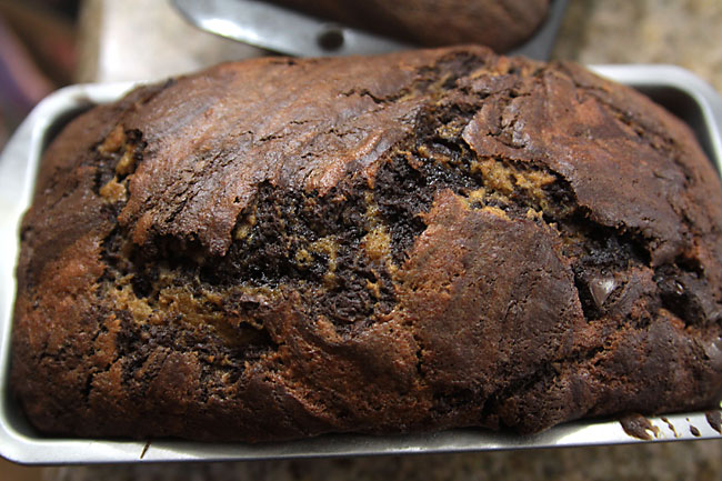 Pumpkin chocolate swirl bread in a bread tin