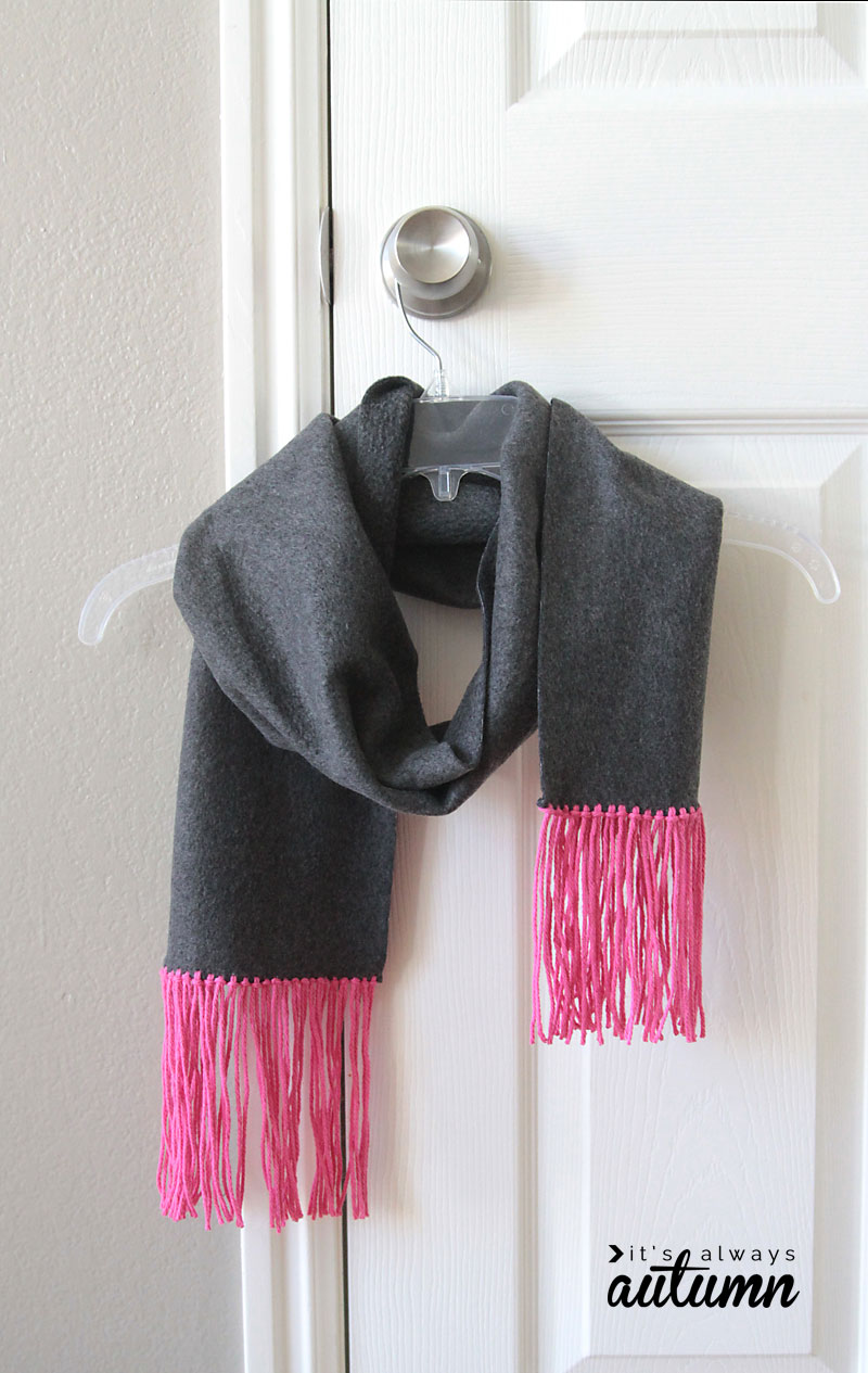 A no sew scarf with fringe on a hanger