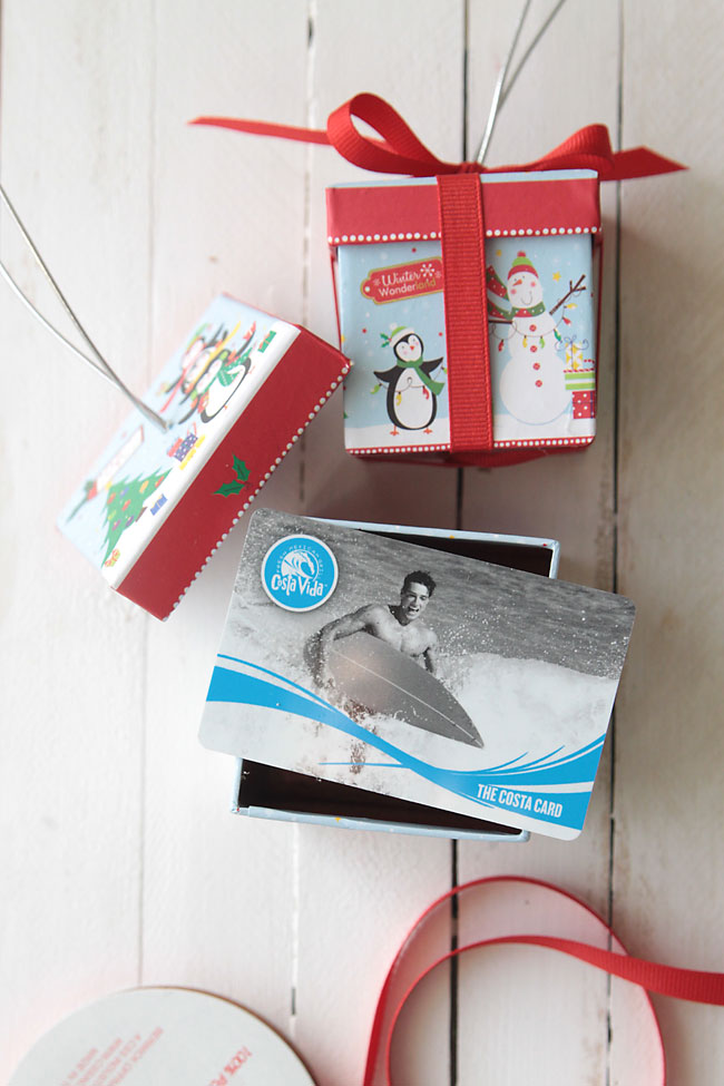 cute idea! easy DIY Christmas tree ornament that's a gift box - perfect for gift cards, jewelry, movie tickets, notes & more - and the boxes are from the dollar store!