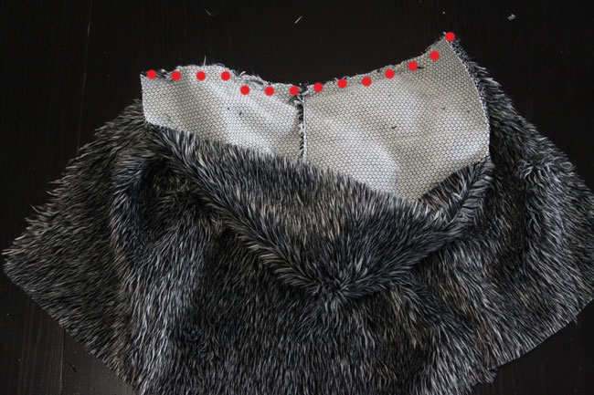 Hood pinned to top of vest