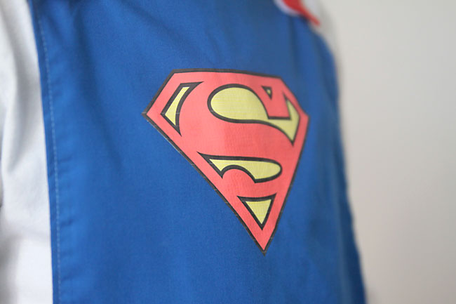 superman logo on a blue cape
