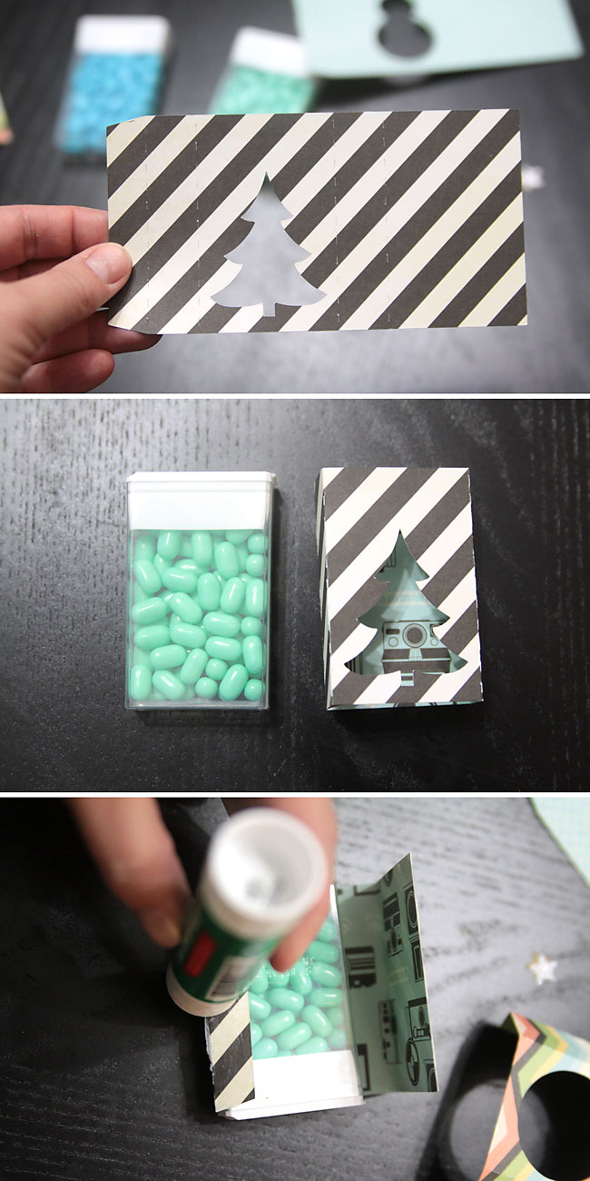 green tic tac container covered in paper with christmas tree cutout