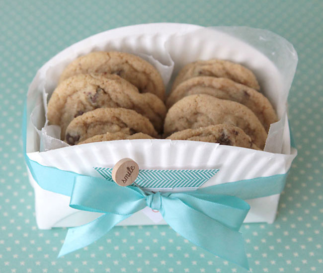 cookie basket made from a folded paper plate tied with ribbon