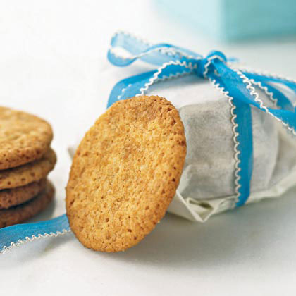 stack of cookies tied up in wax paper tied with a blue ribbon