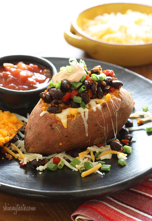 Loaded baked sweet potato on a plate