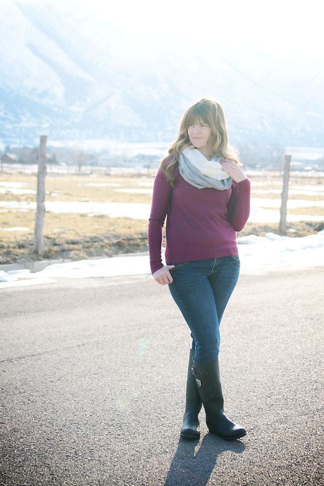 a woman wearing a lace and knit infinity scarf