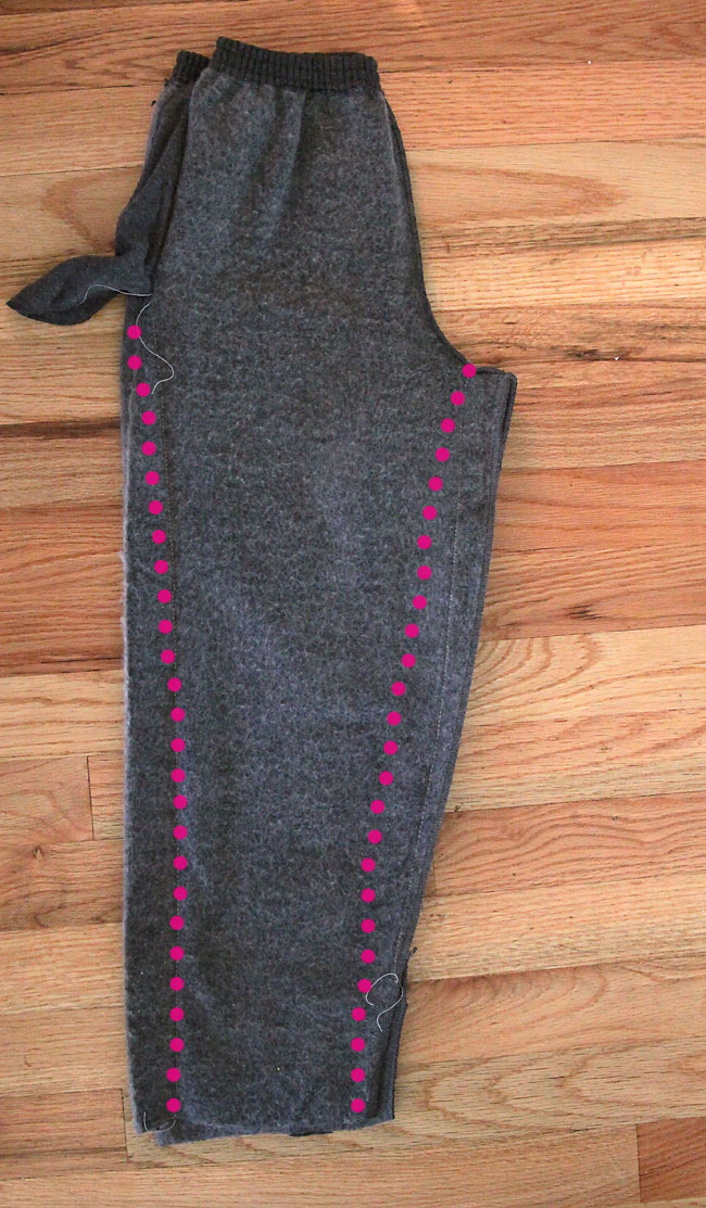 A pair of sweatpants turned inside out, with new seams marked