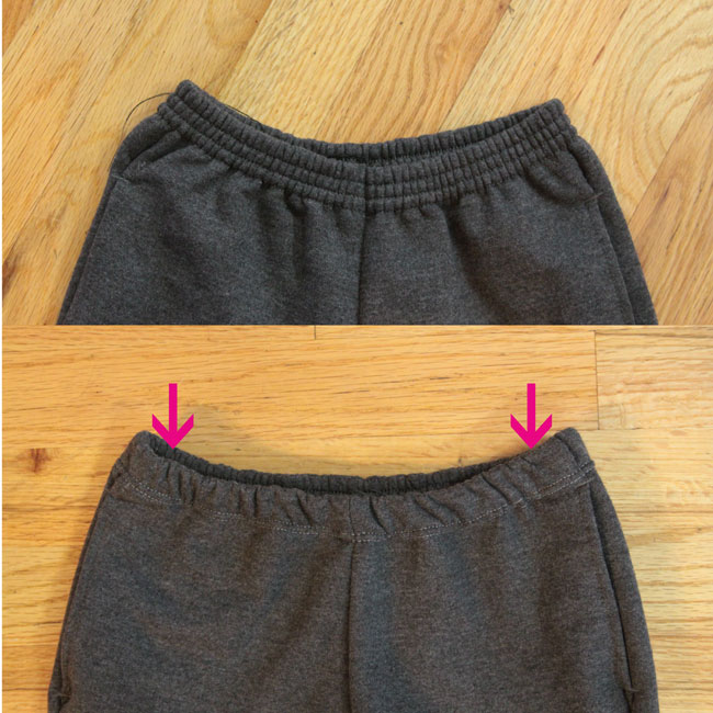 Waistband of a pair of sweatpants folded down and sewn with a double needle