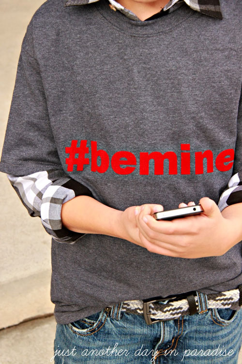 a grey t-shirt with #bemine on it